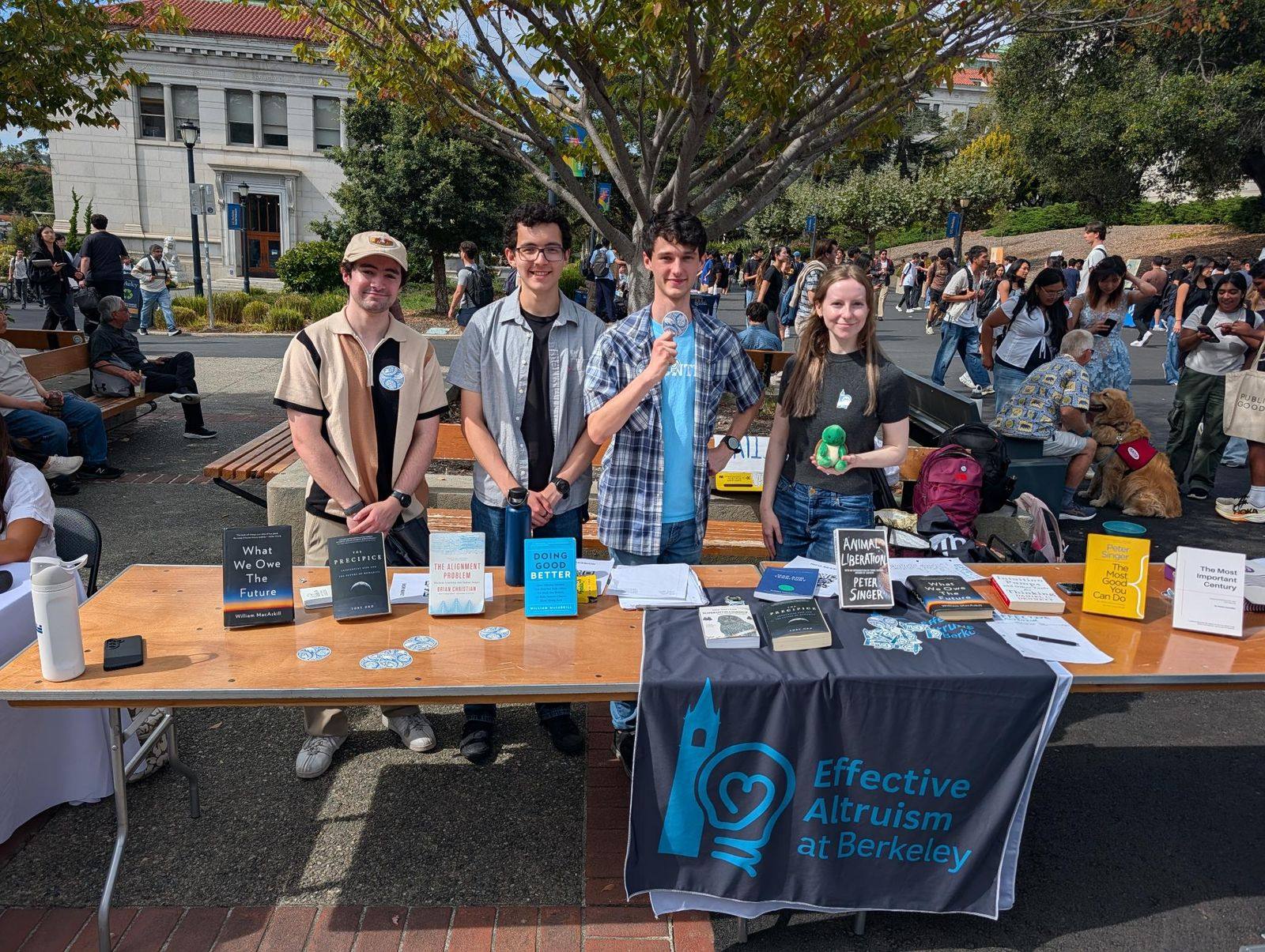 Officers tabling for EA Berkeley on Sproul Plaza in Fall 2026, with books and an Effective Altruism at Berkeley banner.
